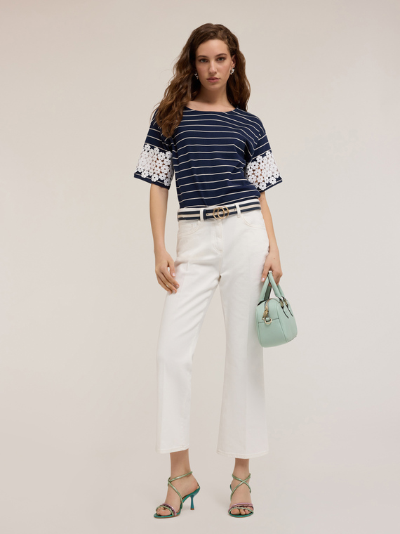 Pantaloni kick flare in drill di cotone