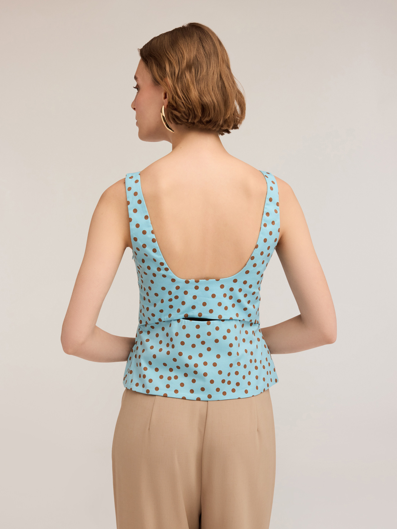 Polka dot bustier top with cut-out back image number 1