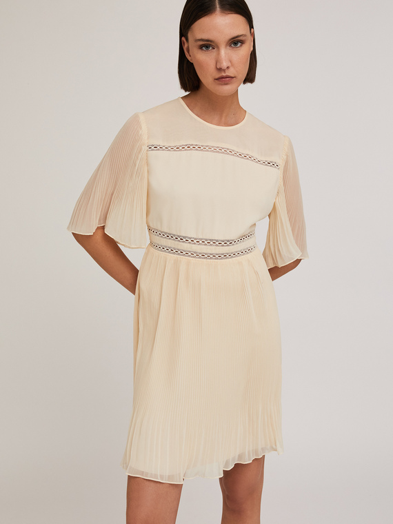 Embroidered dress with pleated details